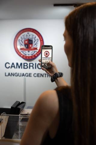 Student scanning a Cambright QR code at the reception area