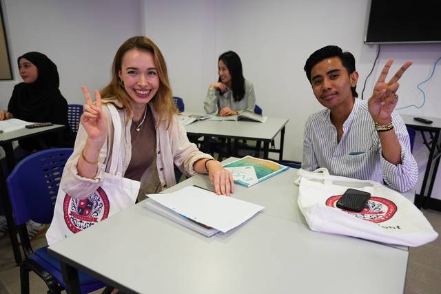 Two students smiling in a classroom at Cambright
