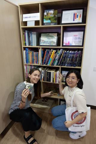 Two students smiling in a study corner at Cambright
